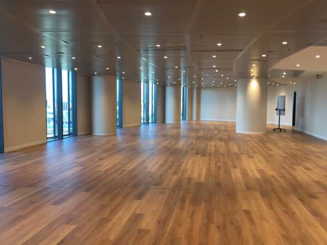 Spacious Amsterdam event venue with large windows for conferences and gatherings.