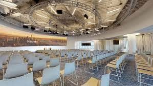 Modern event space with circular seating for presentations at Convene 1221 6th Ave.