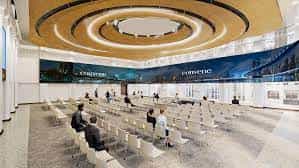 Modern event venue with circular ceiling, ideal for conferences and networking events.