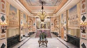 Opulent Westin Palace Madrid lobby with grand chandelier, ideal for upscale events.