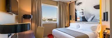 Modern hotel room in NH Collection Suecia, ideal for business retreats with city views.