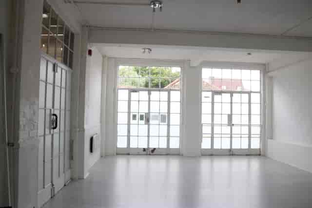 Bright, spacious M.E.D Studio with large windows for modern events and workshops.