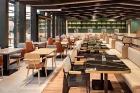 Modern dining space at Melia Avenida de America, perfect for networking events and meetings.
