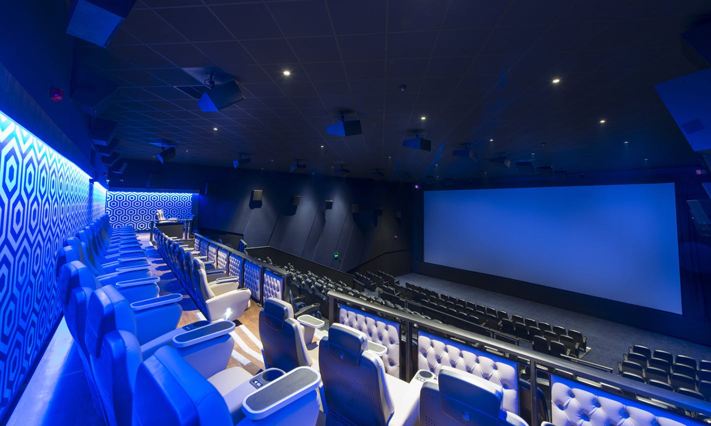 Modern cinema auditorium with tiered seating for film screenings and corporate events.