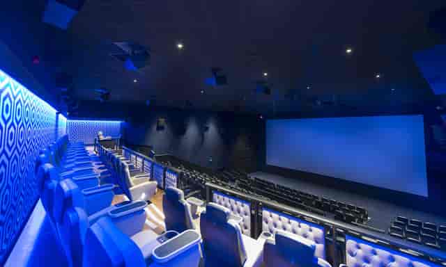 Modern cinema auditorium with tiered seating for film screenings and corporate events.