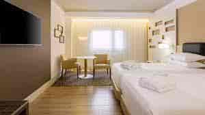 Modern hotel room at Madrid Marriott, ideal for events and networking.