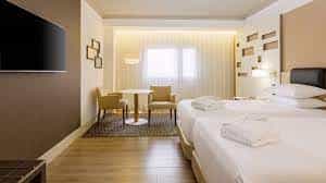 Modern hotel room at Madrid Marriott, ideal for events and networking.