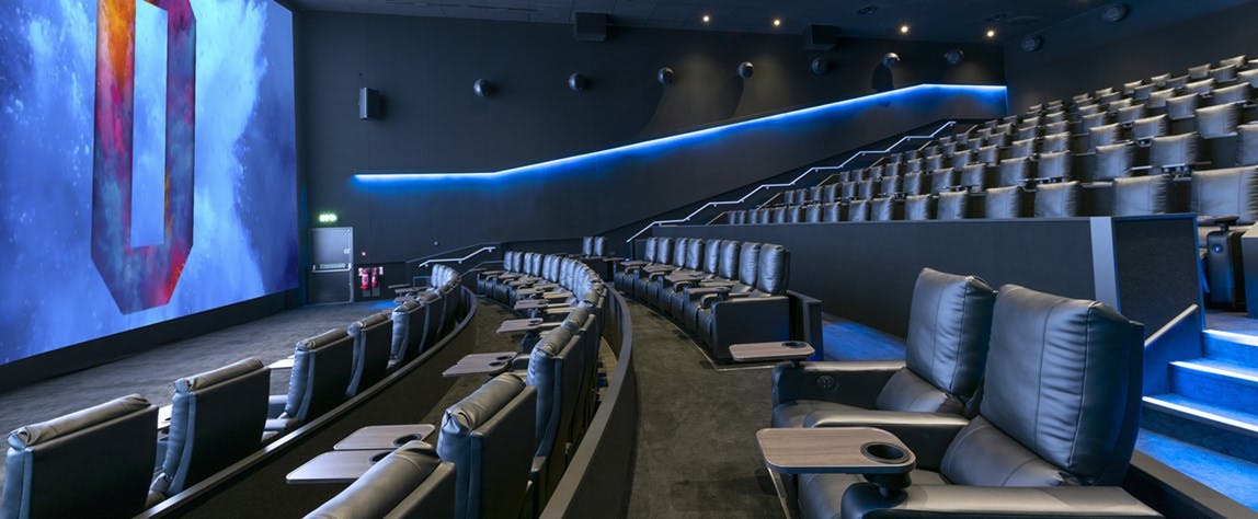 Modern ODEON cinema with plush seating and large screen for corporate events and screenings.