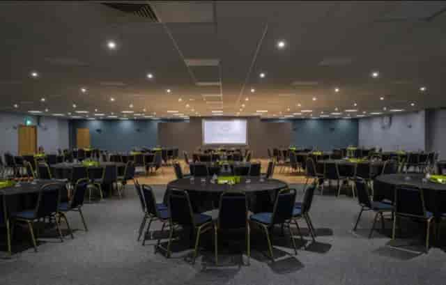 Fair Isle event space with round tables, ideal for corporate banquets and conferences.