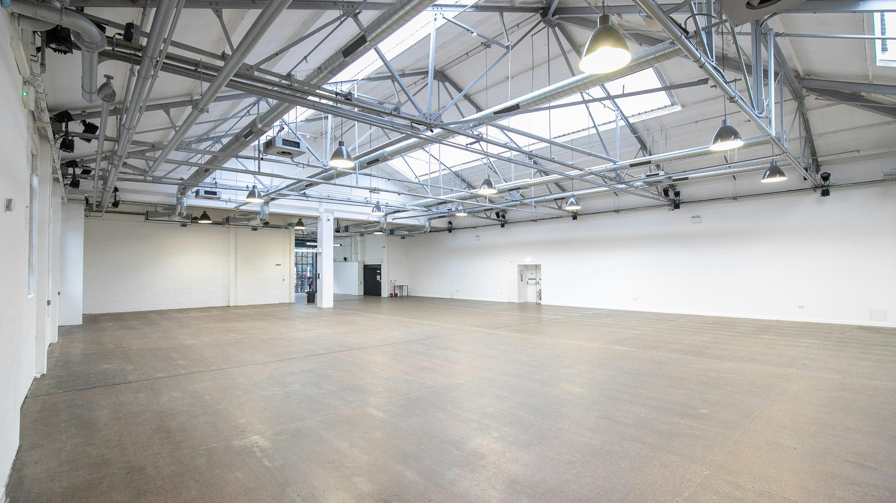 Spacious event venue with high ceilings for conferences and exhibitions at Protein Studios.