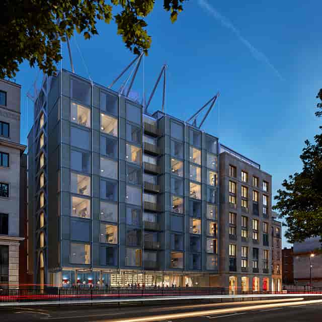 Modern venue with glass facade, ideal for corporate events and social gatherings.