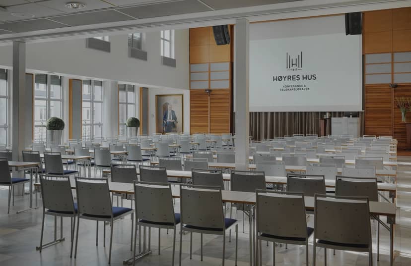 Nordengen event space with rows of chairs for a corporate presentation or conference.