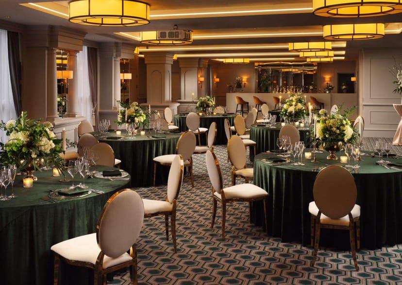 Elegant Gandon Suite event space with green linens, ideal for upscale gatherings and formal dinners.