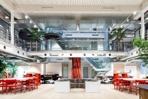 Modern event venue 180 Atrium with natural light and flexible seating for meetings.