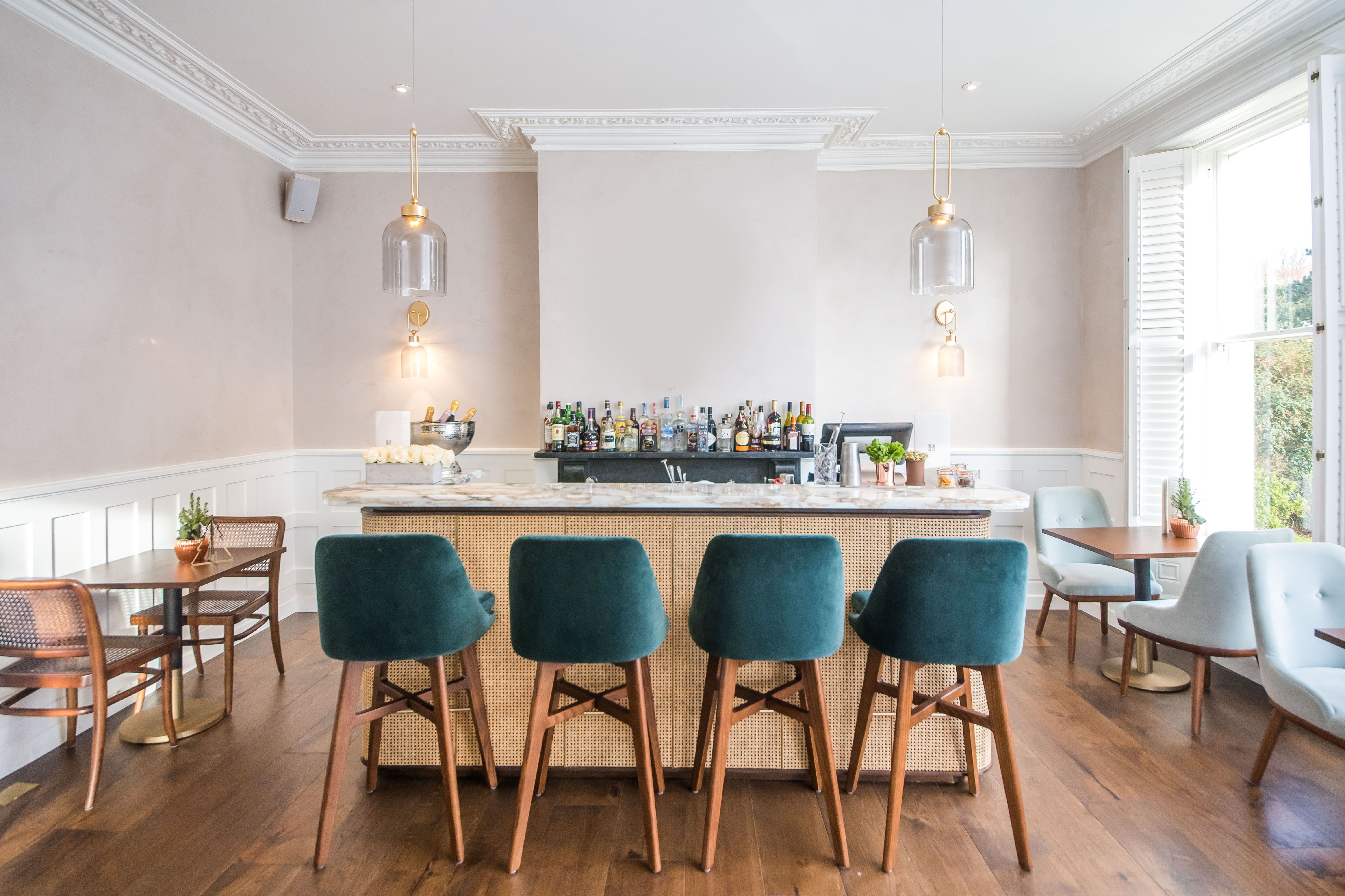 Stylish bar area at Henrietta Bar & Garden, ideal for cocktail receptions and networking events. - Banner