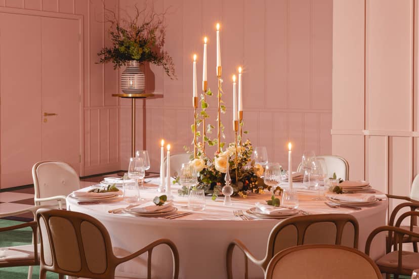 Elegant round table with floral centerpiece in Creative Room 1, perfect for weddings and events.