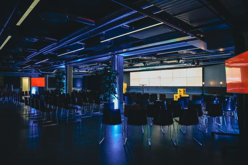 Modern event space in Disruption Hall, Epicenter Stockholm, set for a presentation.