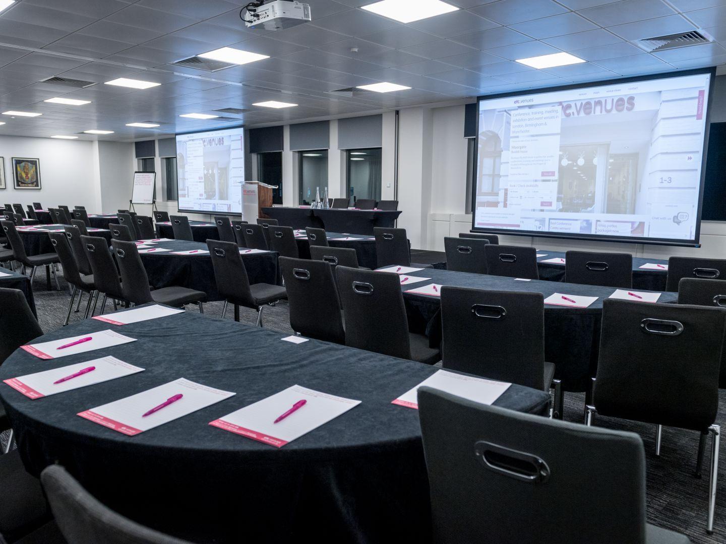 Exclusive Hire meeting room with round tables, ideal for professional events and conferences. - Banner