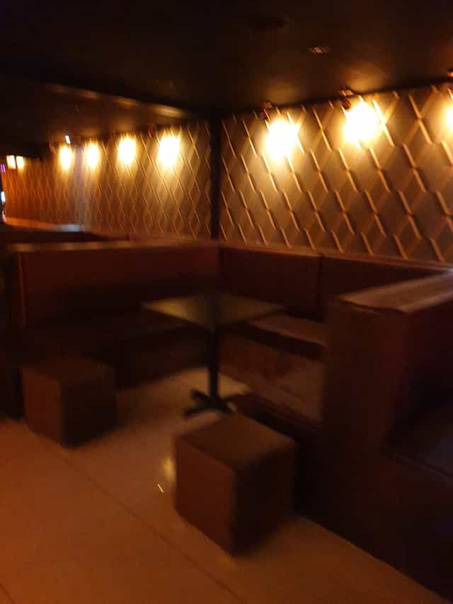 Cozy seating area in Miniature Restaurant, ideal for small meetings and gatherings.