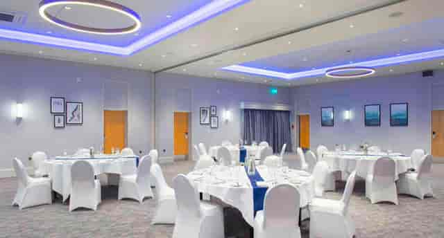 Elegant event space at Sedgebrook Hall with round tables for weddings and corporate gatherings.