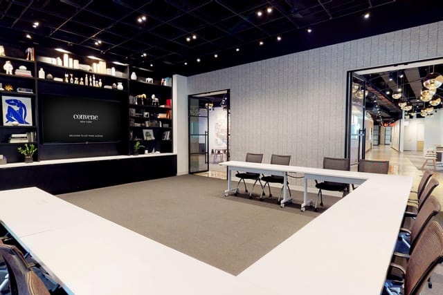 Modern meeting room with U-shaped table for presentations and workshops at Convene 237 Park Avenue.