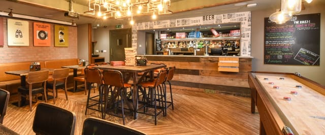 Modern Mezzanine at Tank & Paddle, ideal for casual meetings and events.