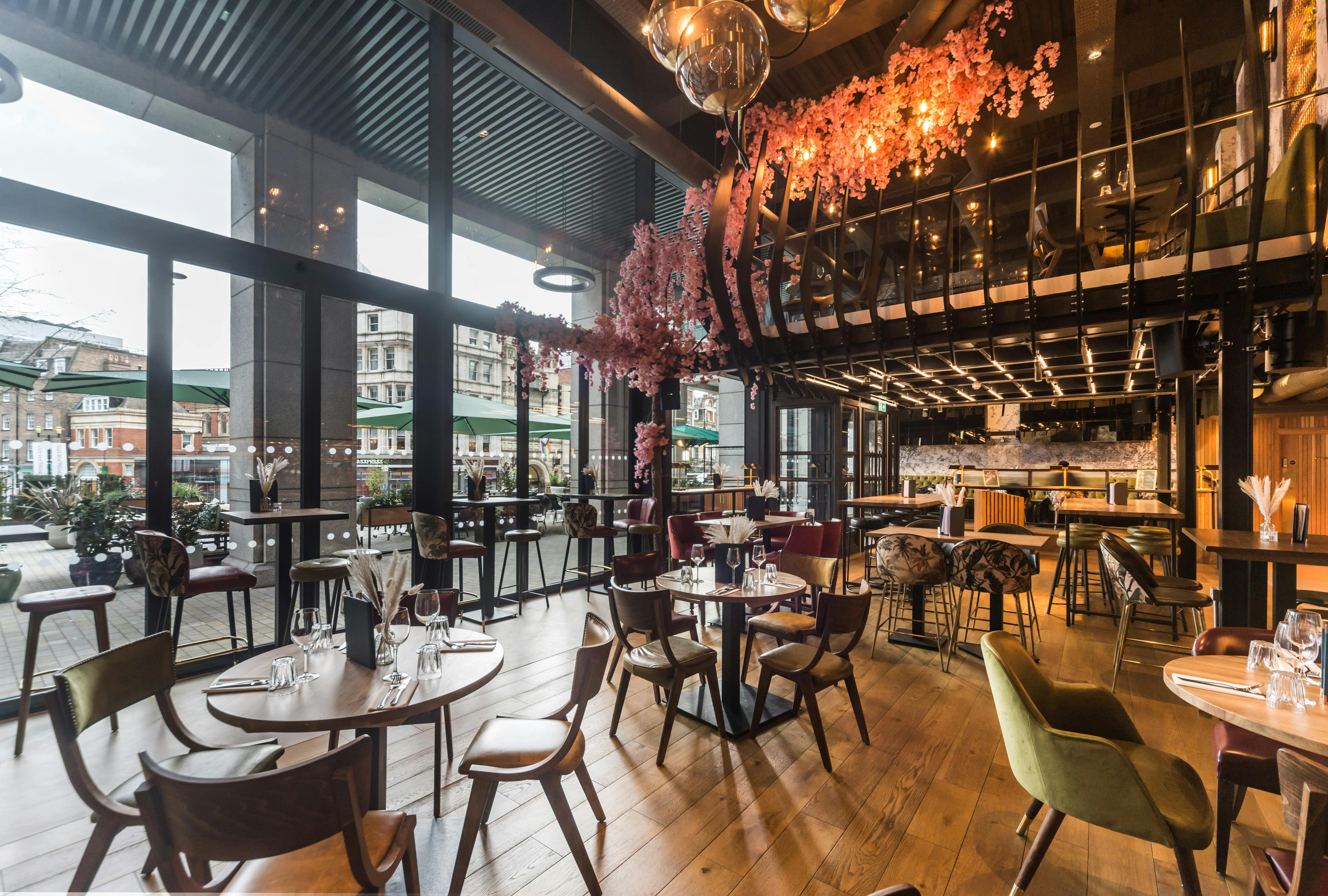 Stylish event space at Nest Bishopsgate with large windows, ideal for corporate meetings.