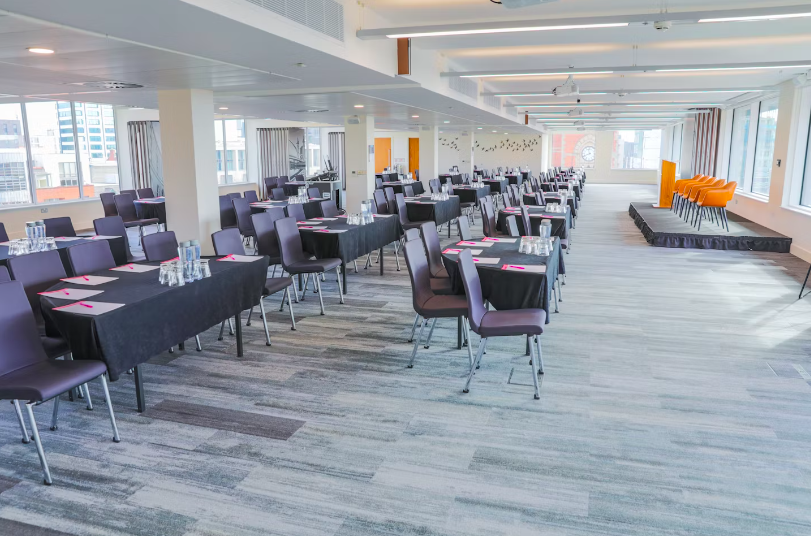 Conference setup in Etc.venues Manchester with natural light and professional ambiance. - Banner