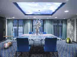 Modern meeting room at Radisson Blu Amsterdam with sky-themed ceiling, perfect for corporate events.