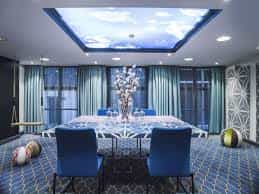 Modern meeting room at Radisson Blu Amsterdam with sky-themed ceiling, perfect for corporate events.