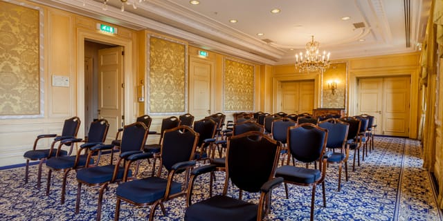 Elegant Stadhouders Room with black chairs, ideal for corporate meetings and upscale events.