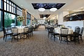 Elegant event space with round tables, ideal for meetings and celebrations in Tarrytown.