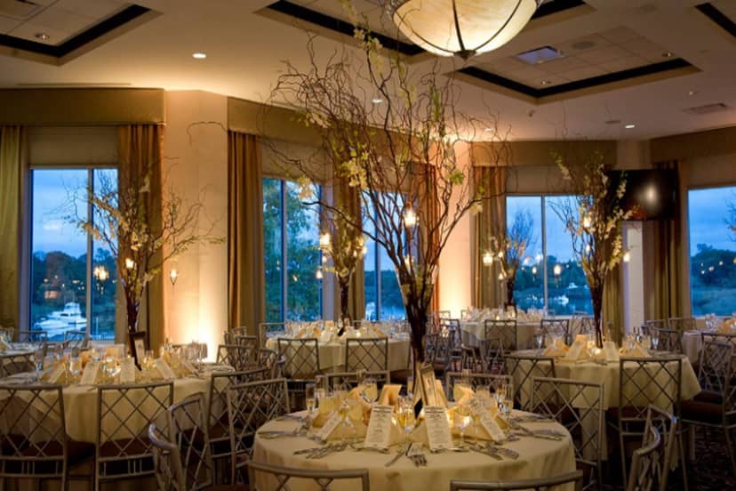 Elegant event space at Hyatt Place East End with round tables and warm ambiance.