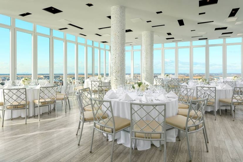 Elegant event space with panoramic windows at The Allegria Hotel for weddings and corporate events.