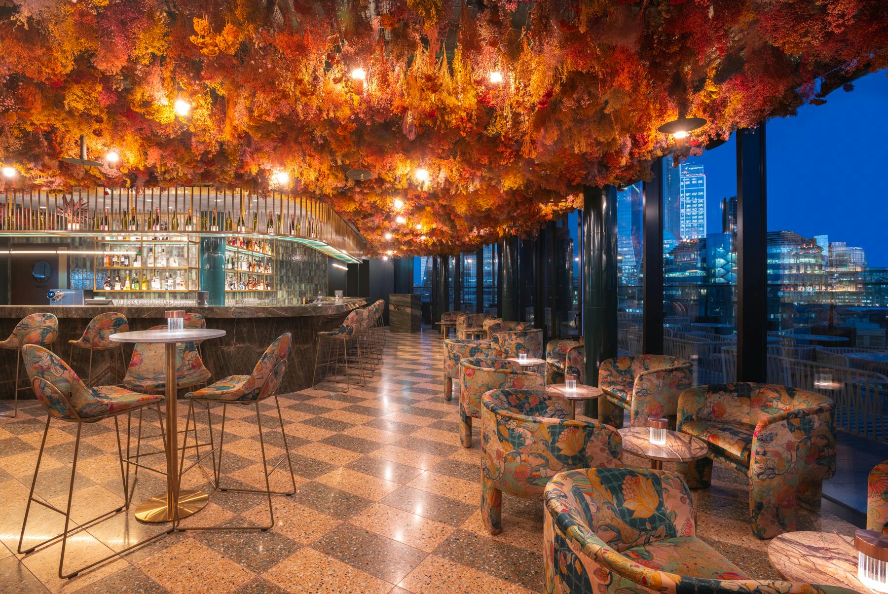 Stylish venue with floral ceiling, perfect for upscale events and gatherings.