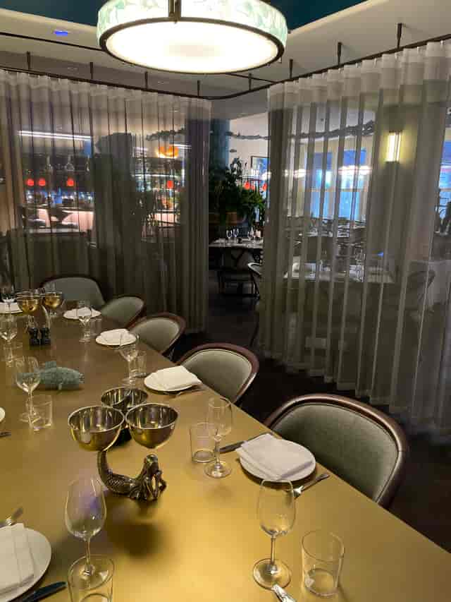 Elegant semi-private dining room for intimate corporate dinners and networking events.