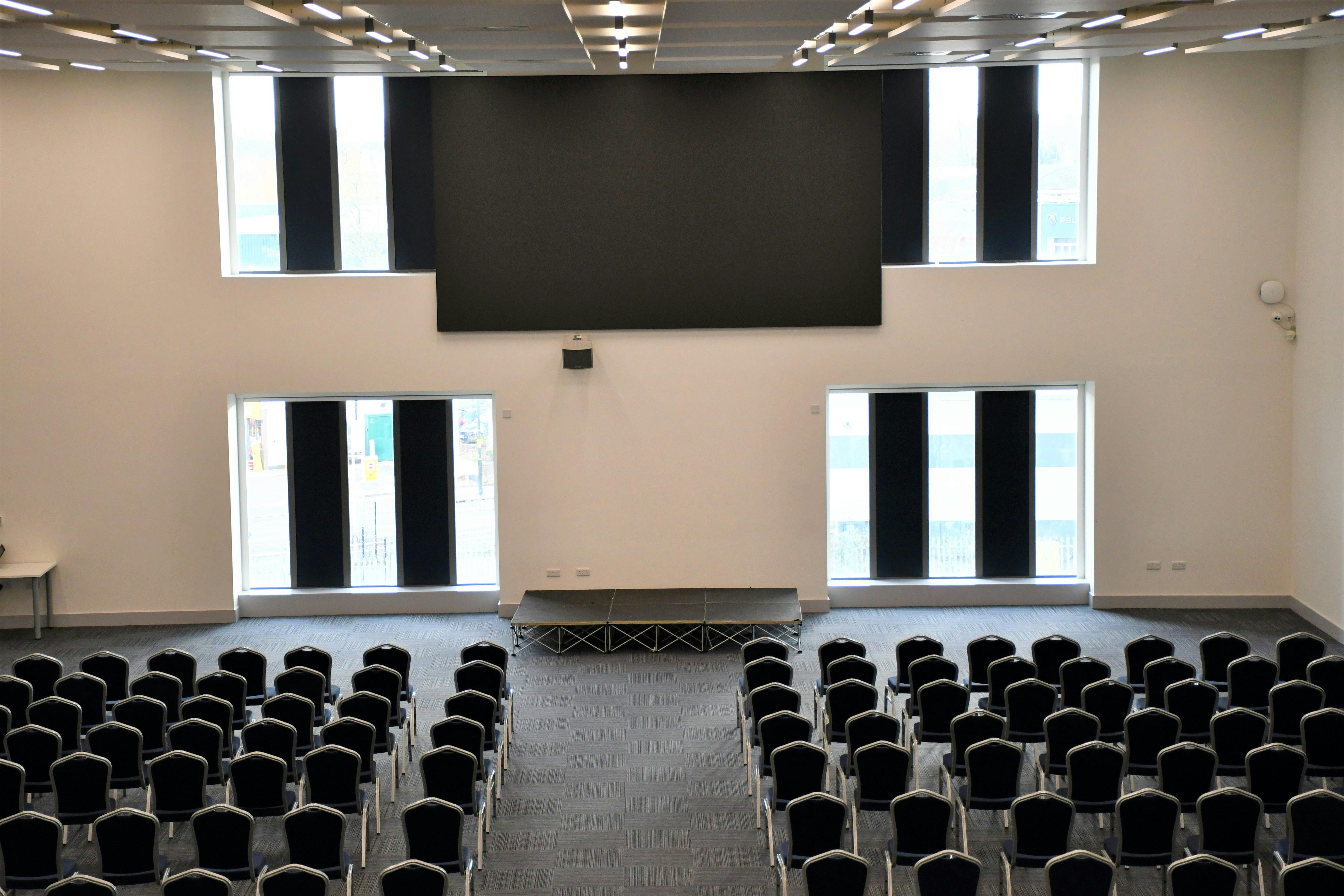 Spacious Silver Lounge venue in AFC Wimbledon set for a conference presentation.