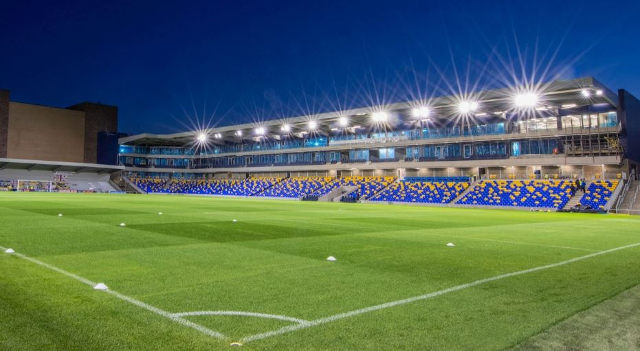 Silver Lounge at AFC Wimbledon: modern stadium with green turf for events and gatherings. - Banner