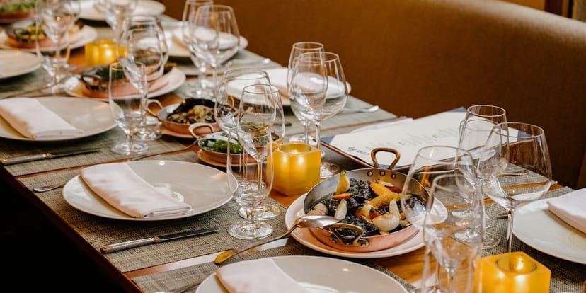 Private dining room with elegant table setting for corporate dinners and high-end events.