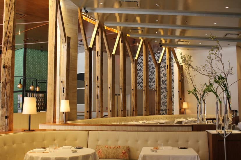 Stylish dining space with warm wood accents for upscale events and intimate meetings.