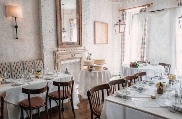 Elegant dining room in Bobo, NY with floral centerpieces for events and gatherings.