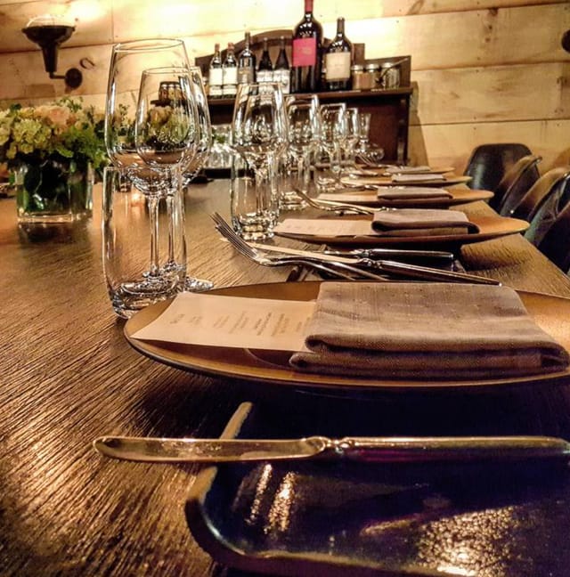 Elegant dining table setup in The Cellar, perfect for corporate dinners and special events.
