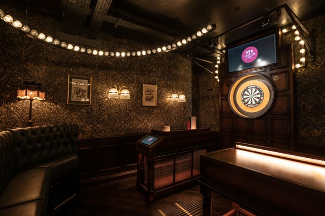 Stylish event space at The Upstairs Bar, Flight Club Birmingham, ideal for networking and gatherings.