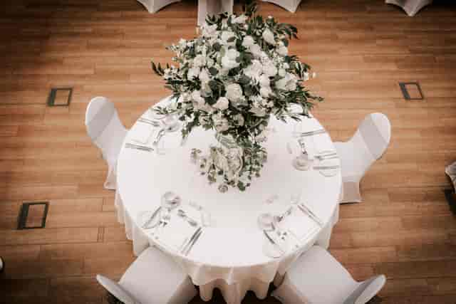 Elegant round table with floral centerpiece for formal events at Hatfield House.