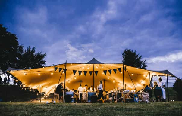 Outdoor event at Hatfield House with illuminated tent, perfect for weddings and retreats.