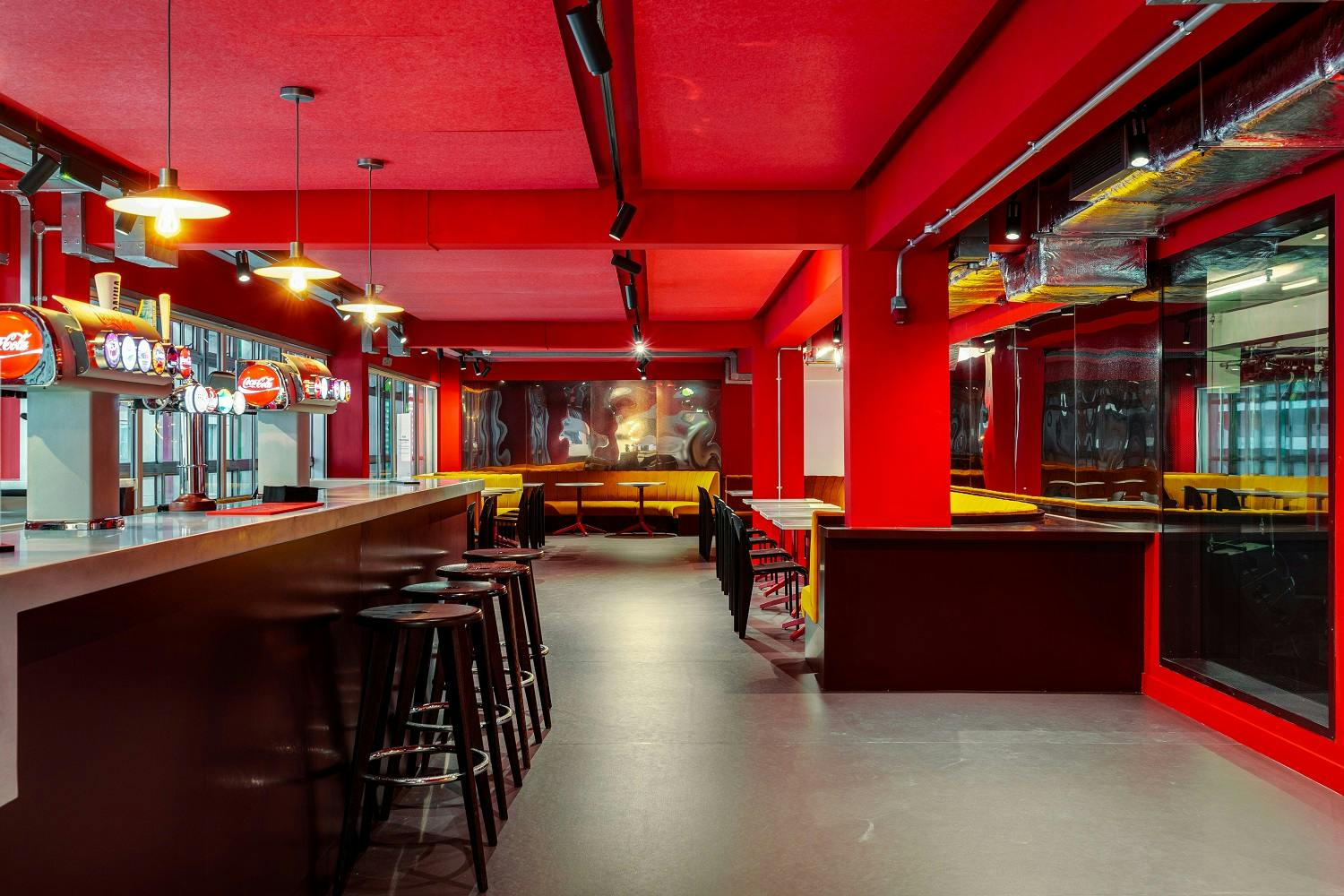 Vibrant Cinema Bar in Rich Mix with bold red walls, ideal for networking events.