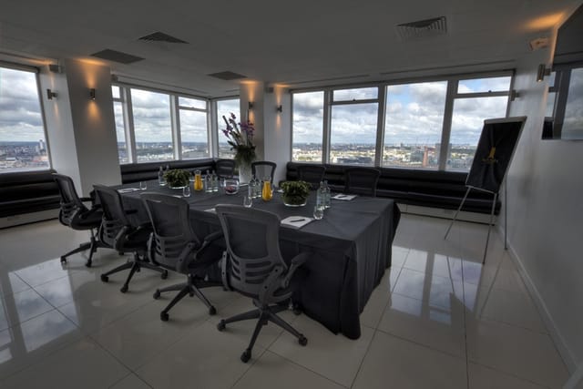 Modern meeting room at Altitude 360 with panoramic city views for corporate events.