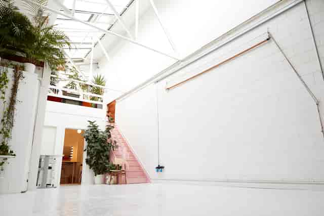 Bright, spacious Peanut Factory Studio with minimalist design for creative events and meetings.
