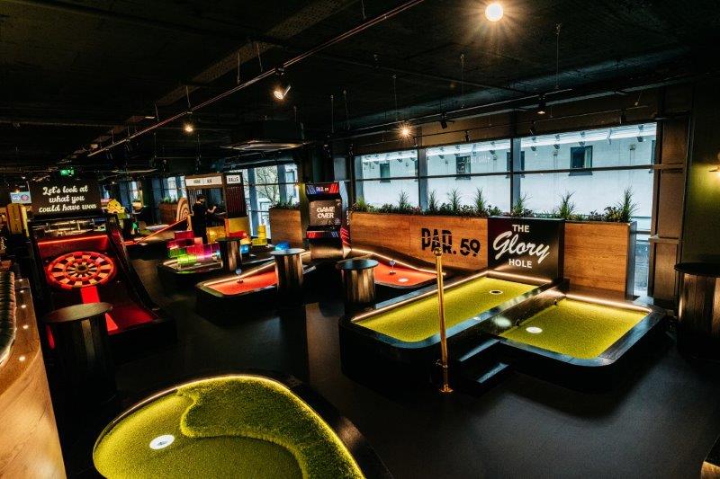 Vibrant event space with themed mini-golf for corporate gatherings in Bristol. - Banner