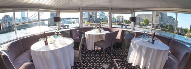 Elegant boat event space on the Thames with panoramic city views for meetings and gatherings.